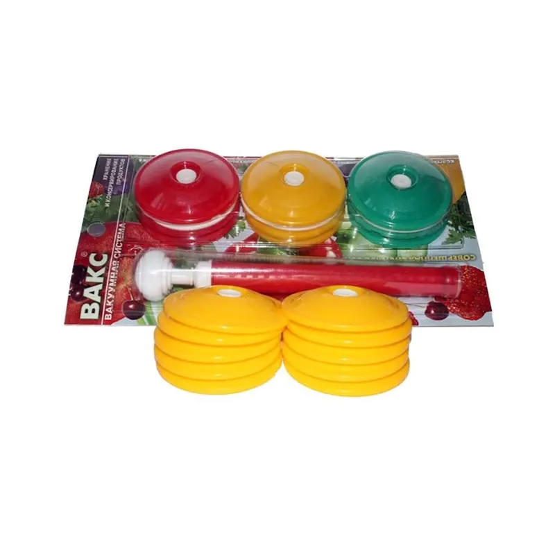 Жёлтые крышки лежат на фоне упаковки системы Вакс